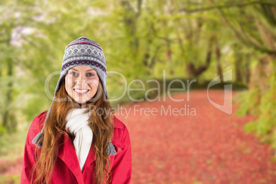 Composite image of pretty redhead in warm clothing