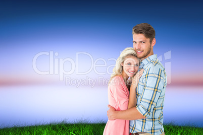 Composite image of attractive couple embracing and smiling at ca