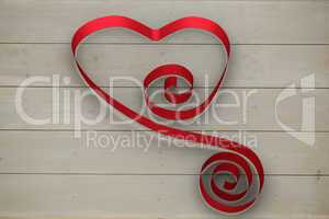 Large red ribbon in a heart shape