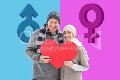 Composite image of happy mature couple in winter clothes holding