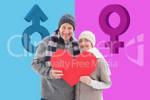 Composite image of happy mature couple in winter clothes holding