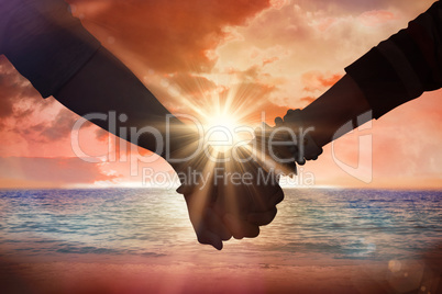 Composite image of students holding hands