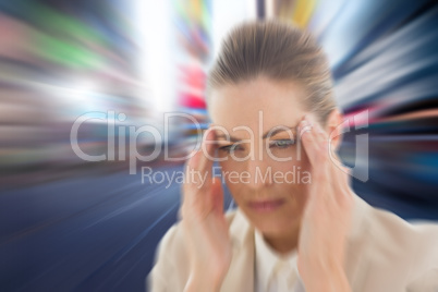 Composite image of woman with headache