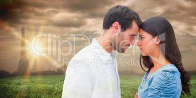 Composite image of angry couple staring at each other