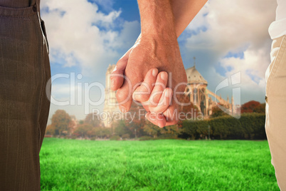 Composite image of happy senior couple holding hands