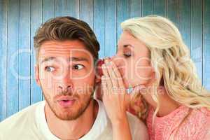 Composite image of attractive blonde whispering secret to boyfri