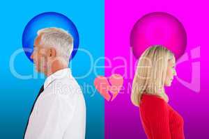 Composite image of couple not talking with broken heart between