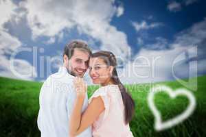 Composite image of attractive young couple smiling at camera