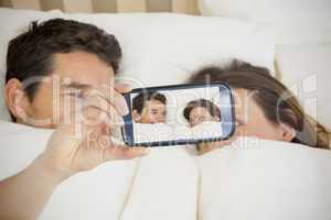 Couple taking selfie on smartphone