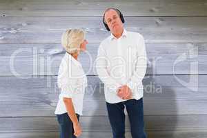 Composite image of annoyed woman being ignored by her partner