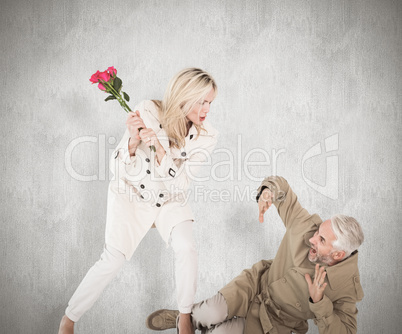 Composite image of angry woman attacking partner with rose bouqu