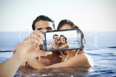 Couple taking selfie on smartphone