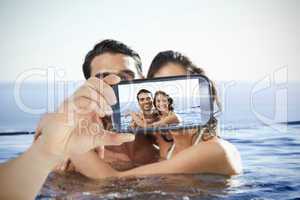 Couple taking selfie on smartphone