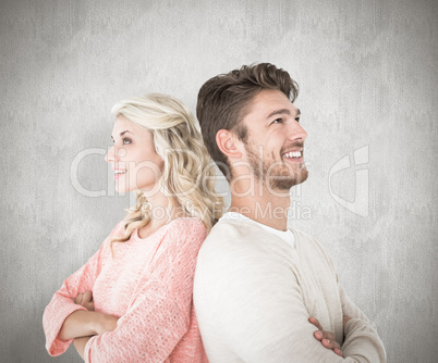 Composite image of attractive couple smiling with arms crossed