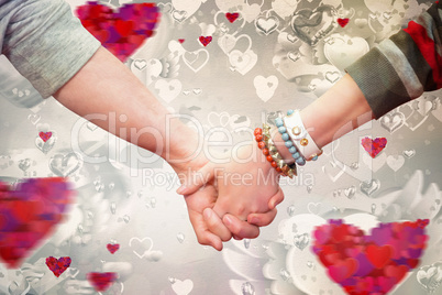 Composite image of students holding hands