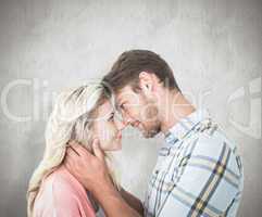 Composite image of attractive couple smiling at each other
