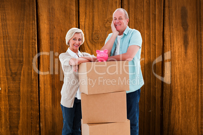 Composite image of older couple smiling at camera with moving bo