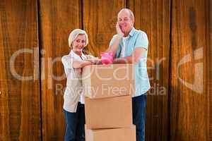 Composite image of older couple smiling at camera with moving bo