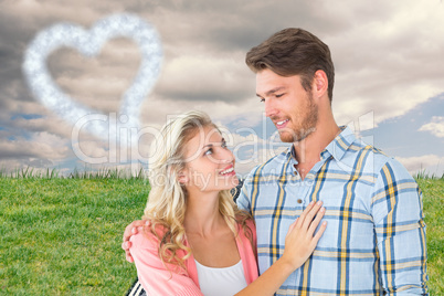 Composite image of attractive young couple smiling at each other