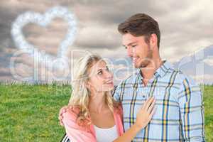 Composite image of attractive young couple smiling at each other