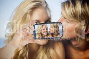 Couple taking selfie on smartphone