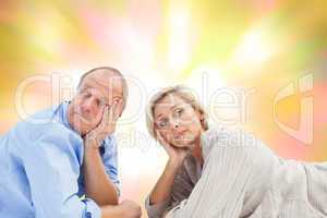 Composite image of mature couple lying and thinking
