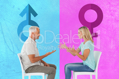 Composite image of unhappy couple sitting on chairs having an ar