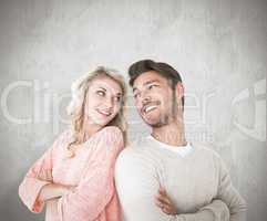 Composite image of attractive couple smiling with arms crossed