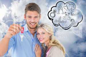 Composite image of attractive young couple showing new house key