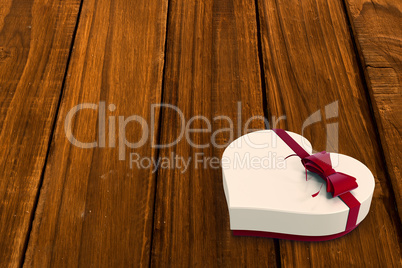 White candy box with red ribbon