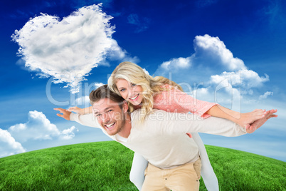 Composite image of handsome man giving piggy back to his girlfri