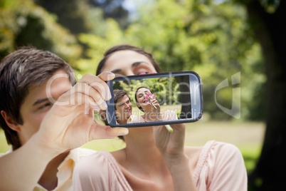 Couple taking selfie on smartphone