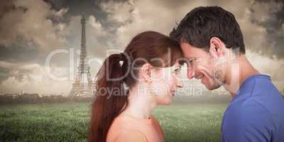 Composite image of couple looking at each other