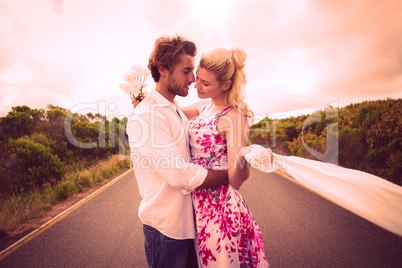 Cute couple standing on the road hugging