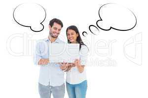 Composite image of attractive young couple holding their laptop