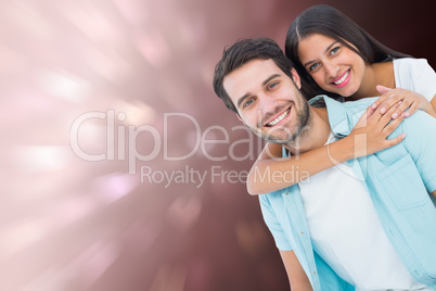 Composite image of happy casual man giving pretty girlfriend pig