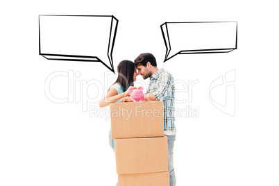 Composite image of happy young couple with moving boxes and pigg