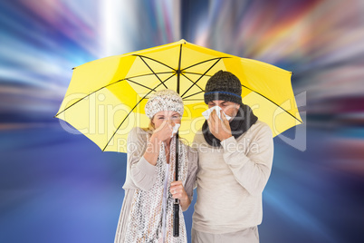 Composite image of couple in winter fashion sneezing under umbre