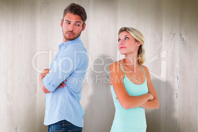 Composite image of unhappy couple not speaking to each other