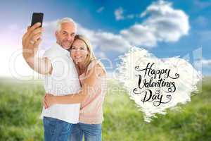 Composite image of happy couple posing for a selfie