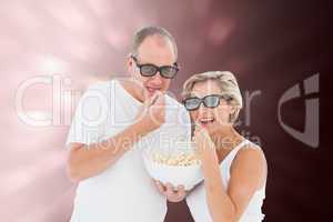 Composite image of mature couple wearing 3d glasses eating popco