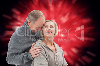 Composite image of happy mature couple in winter clothes