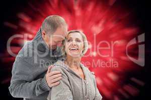 Composite image of happy mature couple in winter clothes