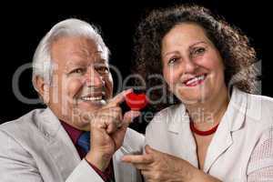 Happy Senior Couple With A Red Valentine Heart