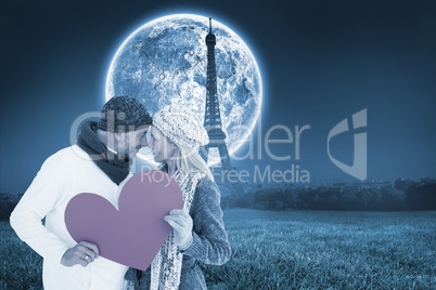 Composite image of smiling couple in winter fashion posing with