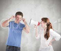Composite image of woman shouting through a megaphone