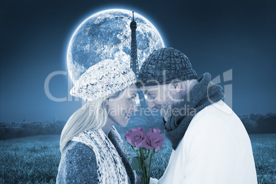 Composite image of smiling couple in winter fashion posing with