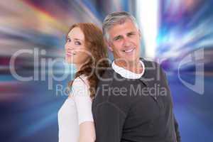 Composite image of casual couple smiling at camera