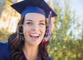 Happy Graduating Mixed Race Woman In Cap and Gown