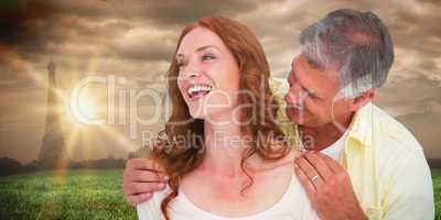 Composite image of casual couple laughing together